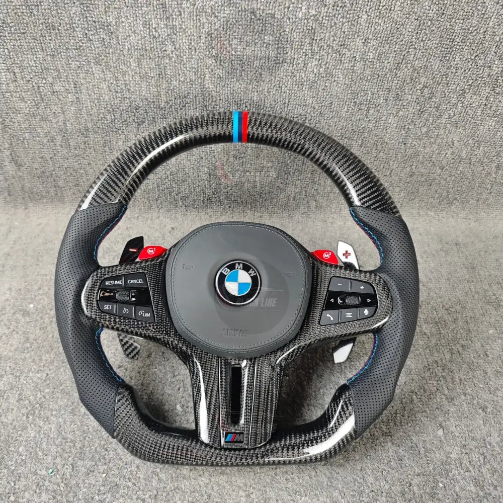 Volante BMW M deportivo en fibra de carbono cuero perforado y botones M1/M2 con airbag incluido