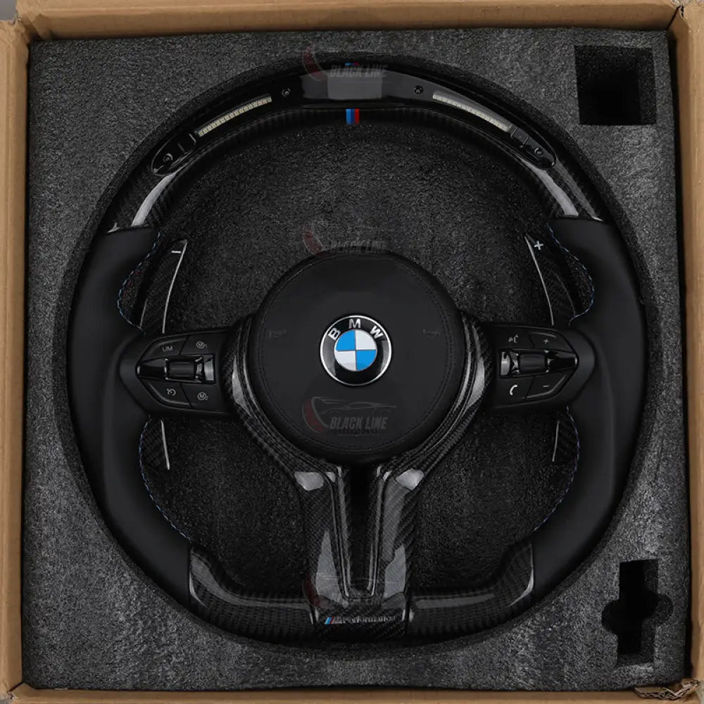 Volante BMW M Performance en Fibra de Carbono y Alcantara con Levas M1/M2 y Race Display