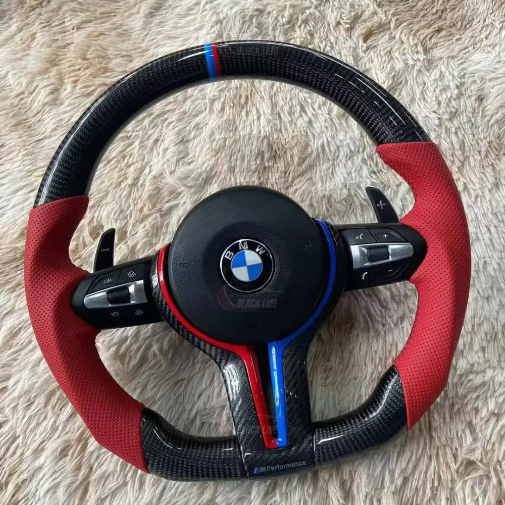 Volante BMW M Performance en Fibra de Carbono y Cuero Rojo Perforado con Levas Multifunción y Detalles M