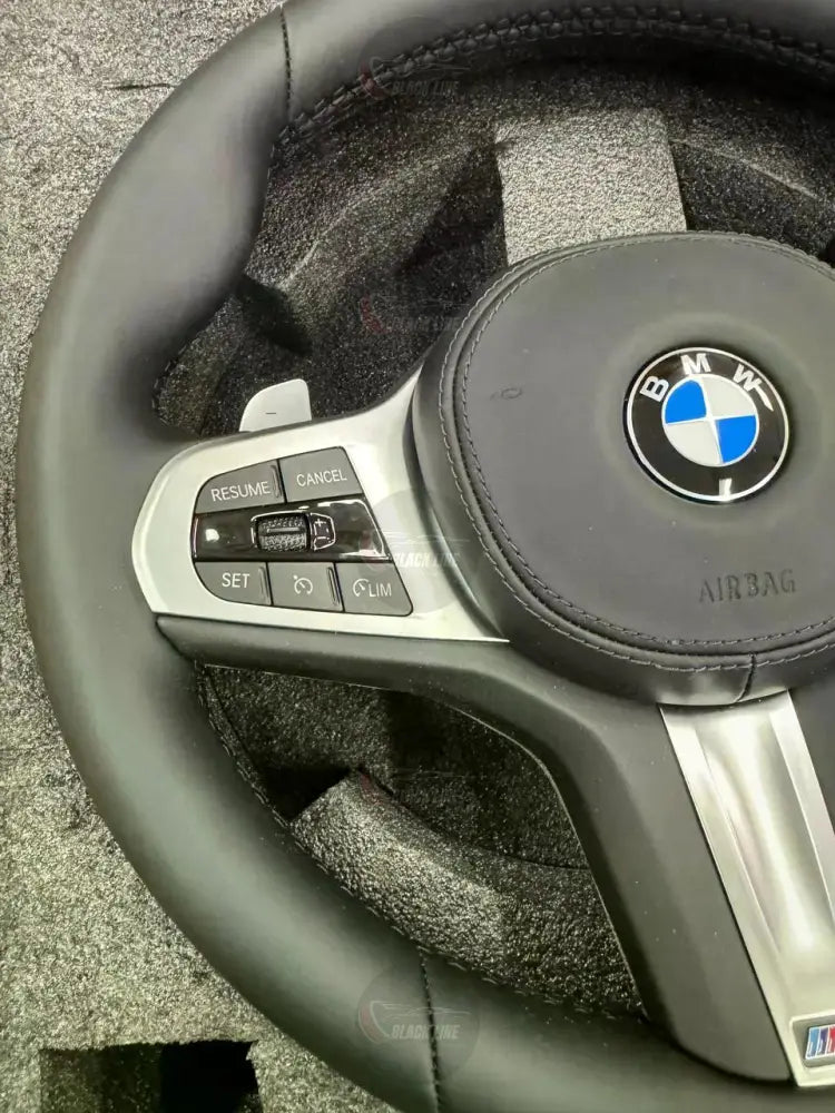 Volante BMW M Sport en Cuero Negro con Levas Multifunción y Acabado Plateado