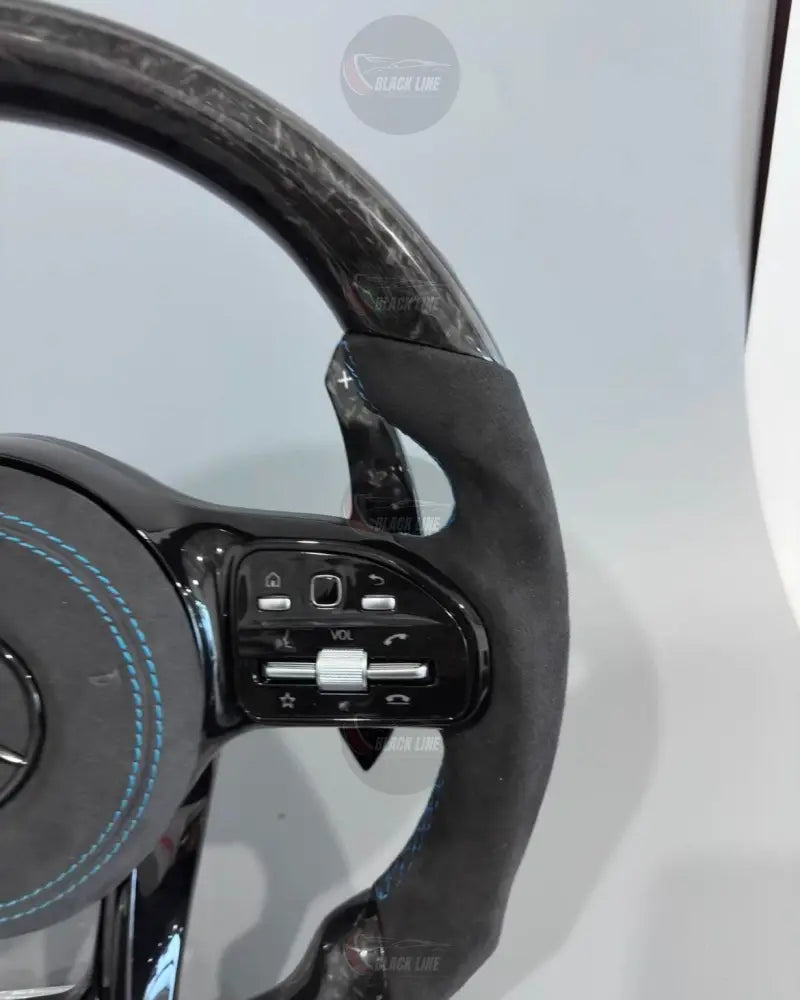 Volante Deportivo Mercedes-AMG de Carbono Forjado y Alcántara con Costura Azul Levas y Airbag Incluido