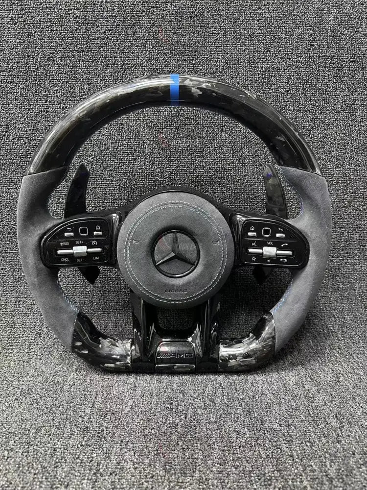 Volante Deportivo Mercedes-AMG de Carbono Forjado y Alcántara con Costura Azul Levas y Airbag Incluido