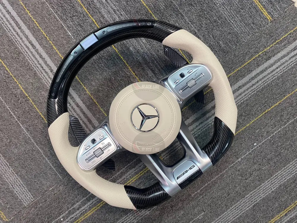 Volante Mercedes-AMG Performance en Fibra de Carbono Cuero Beige Perforado Pantalla y LED con Levas y Multifunción