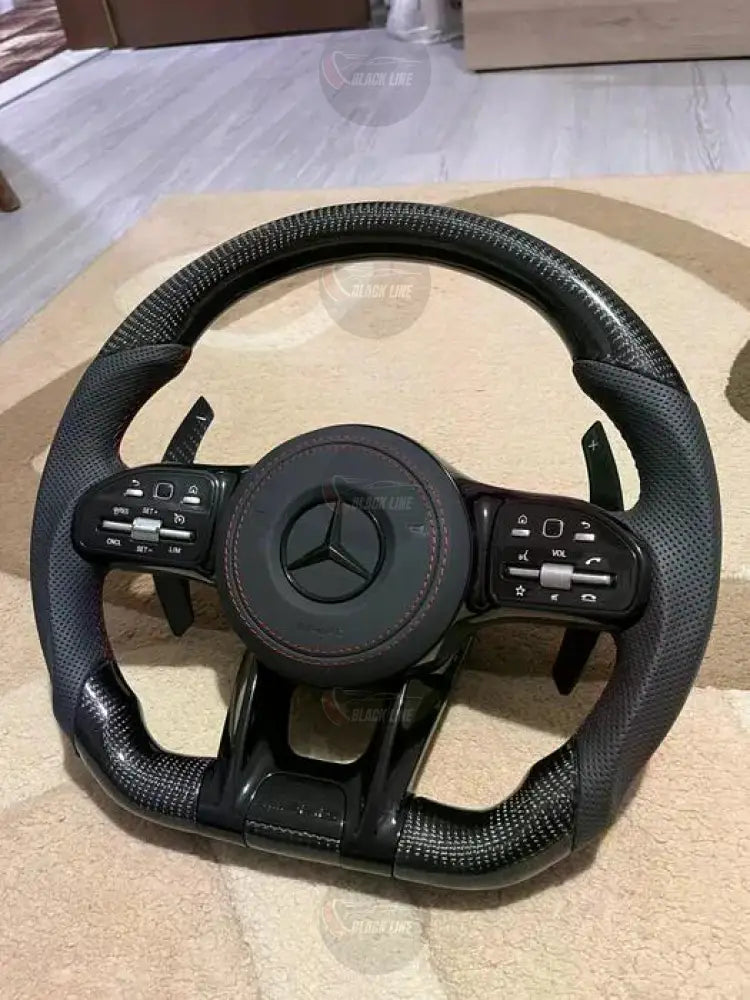 Volante Mercedes-AMG Performance en Fibra de Carbono y Cuero Perforado con Levas y Multifunción
